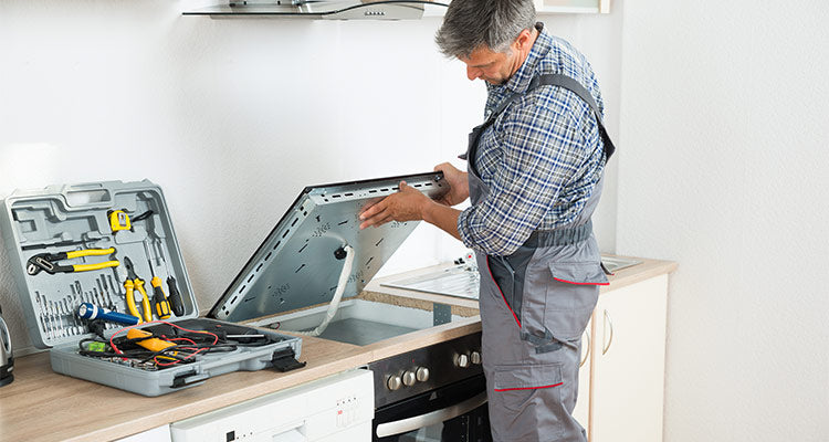 QLAMA technician repairing a dishwasher in Windermere, FL